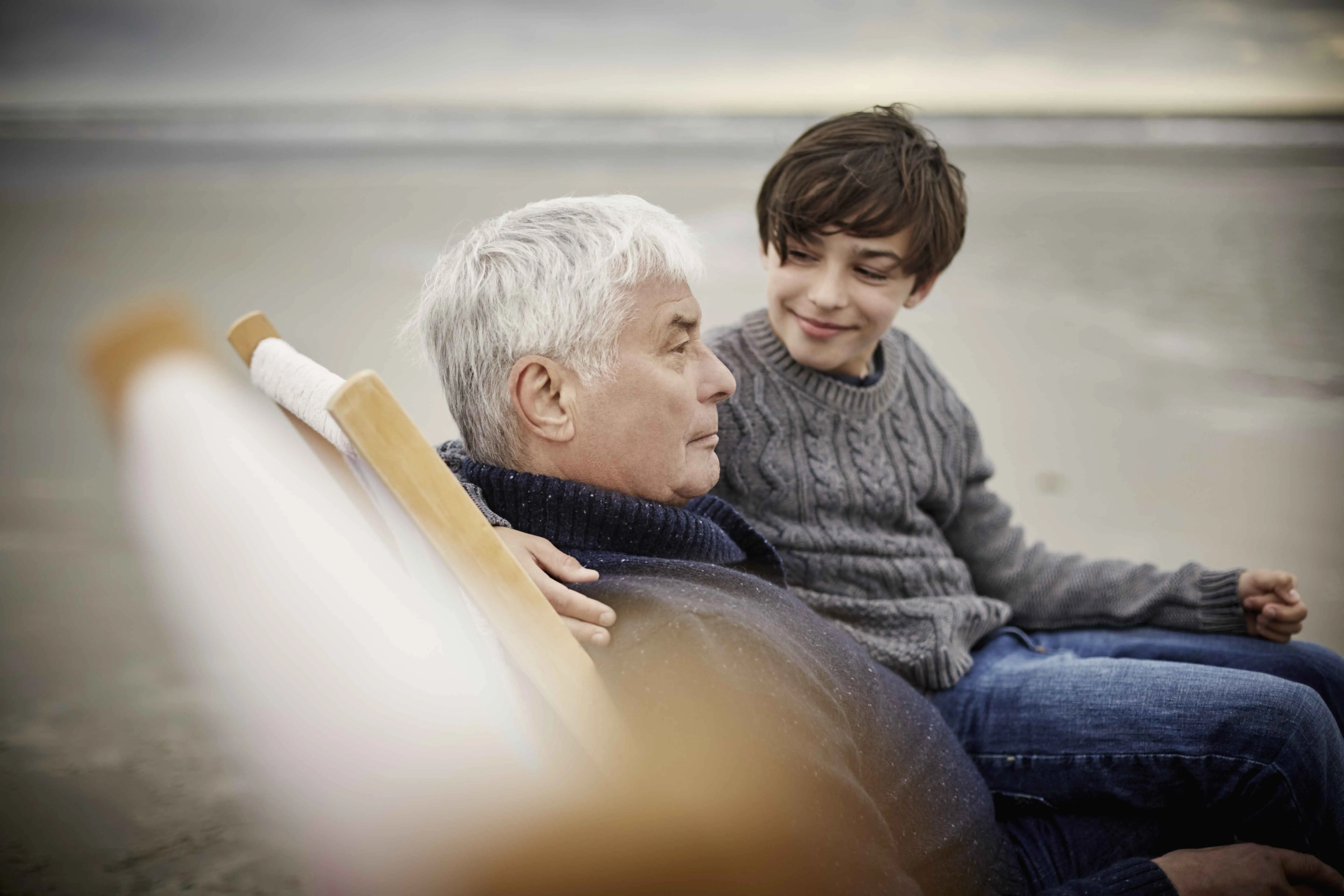 Picture of an elderly patient with a child in the background